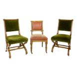 A pair of walnut side chairs,with upholstered backs and seats, on 'X' framed supports, with brass