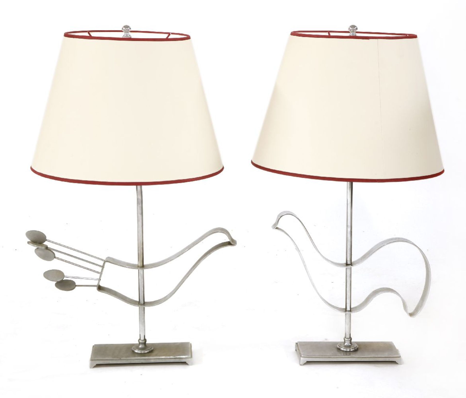 A pair of chrome table lamps,each modelled with birds,71cm high (2)