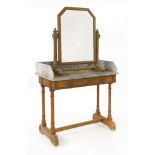 An oak washstand,by Gillows of Lancaster, with a chamfered marble top and three-quarter gallery,