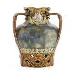 A Doulton Lambeth stoneware vase,by Mark V Marshall, with a pinched rim, three handles with a
