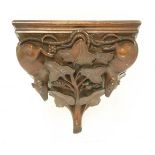 A carved walnut wall bracket,with two rats amongst fruiting vines,29.5cm wide20cm deep27cm high