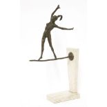 A contemporary bronze and marble sculpture,modelled as a girl balancing on a tight rope, mounted