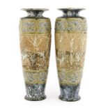 A pair of Royal Doulton stoneware vases,by Hannah Barlow, each incised with a band of deer,