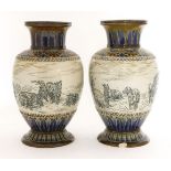 A pair of Doulton Lambeth vases,dated 1885, by Hannah Barlow, each incised with six goats, signed