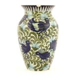 A William De Morgan 'Persian' vase,by Joe Juster, of baluster shape, painted all-over with exotic