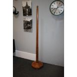 An Arts and Crafts oak standard lamp, on an octagonal spreading base and short feet,153cm high