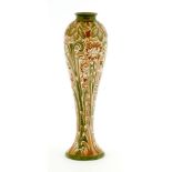 A Moorcroft Florian ware vase, with a green neck, green and pink with raised white motifs, with a