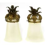 A pair of opaline shades,each of tapering form, mounted with brass with leaf details, one chipped,