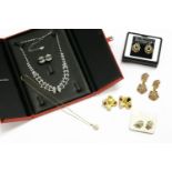 A collection of jewellery to include a pair of Burberry gold plated three row clip on earrings, a