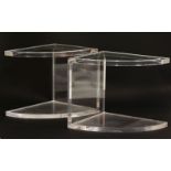 A pair of lucite and glass quarter elliptical lamp tables, on platform bases, 42cm wide x 52cm