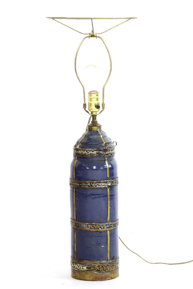 A Marrakesh blue glazed pottery table lamp of cylindrical form with metal mounts