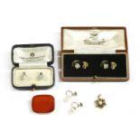 A pair of cased white gold mother of pearl and seed pearl dress studs, marked 9ct, 2.28g, a pair