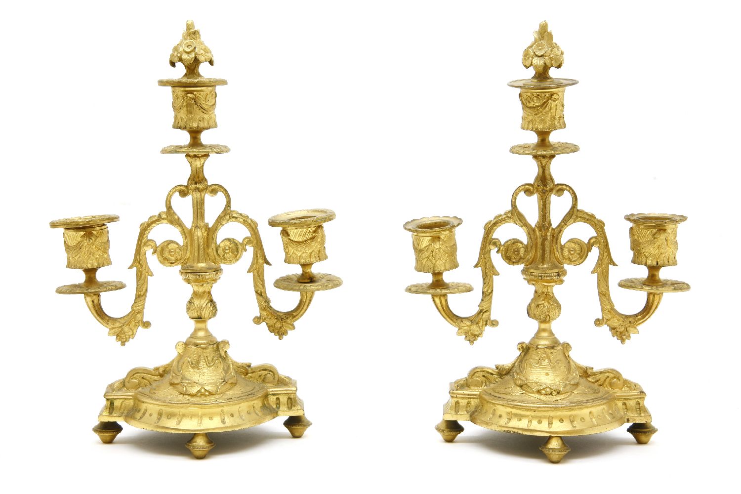 A pair of three branch candelabra, 28cm high