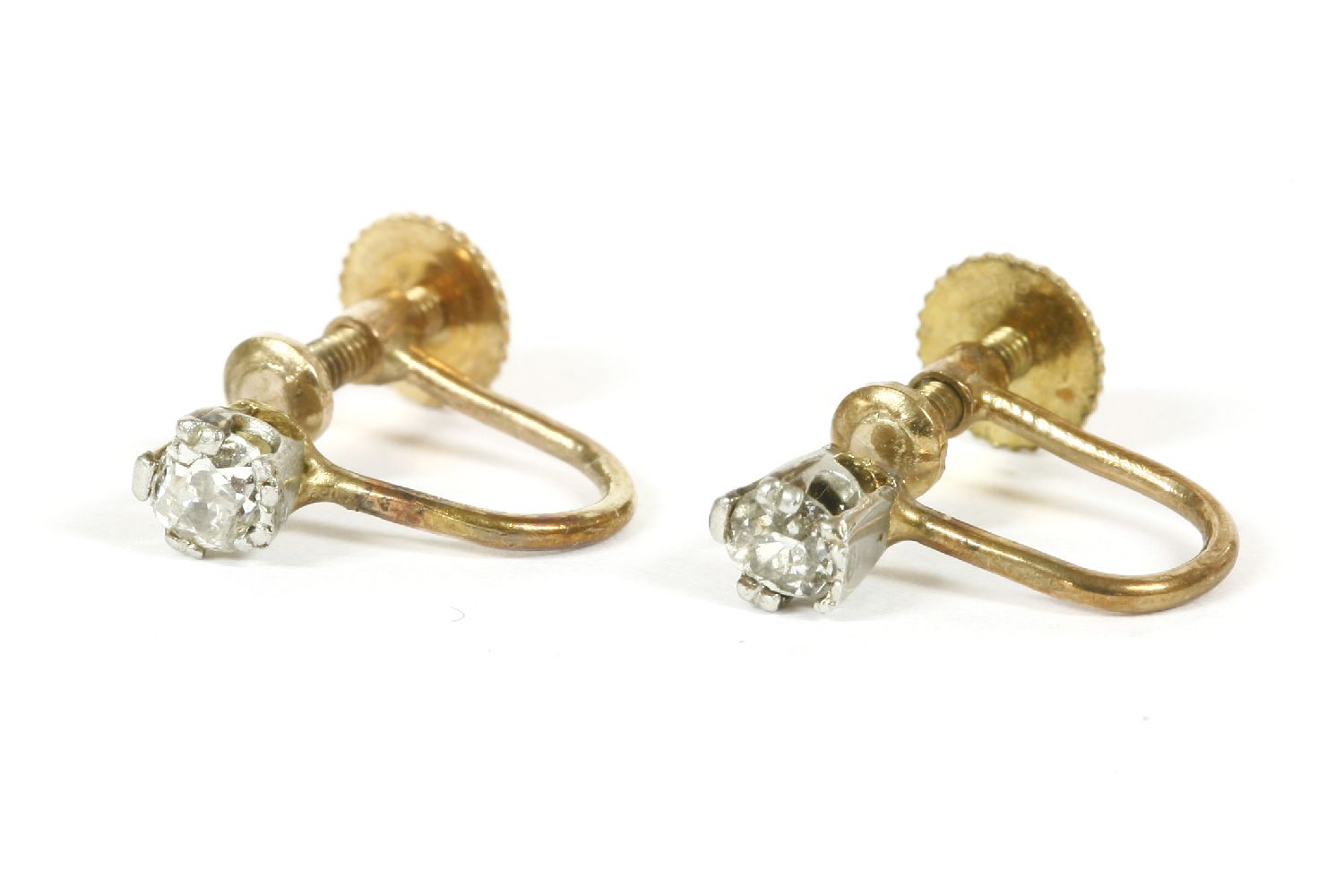 A pair of single stone cushion cut and old Swiss cut diamond screw back earrings, marked 9ct1.27g
