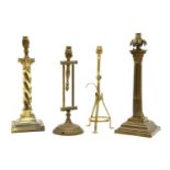 Four brass and metal table lamps