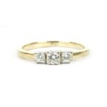 A 9ct gold three stone diamond ring, with plain polished shank1.65g