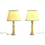 A pair of Chinese carved gilt wood table lamps with ovoid cream and green shades, 75cm high