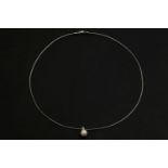 A white gold single stone cultured pearl pendant, with single diamond set bale on wire necklace,
