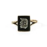 An Edwardian gold rectangular onyx plaque initial signet ring, diamond set initial raised to the