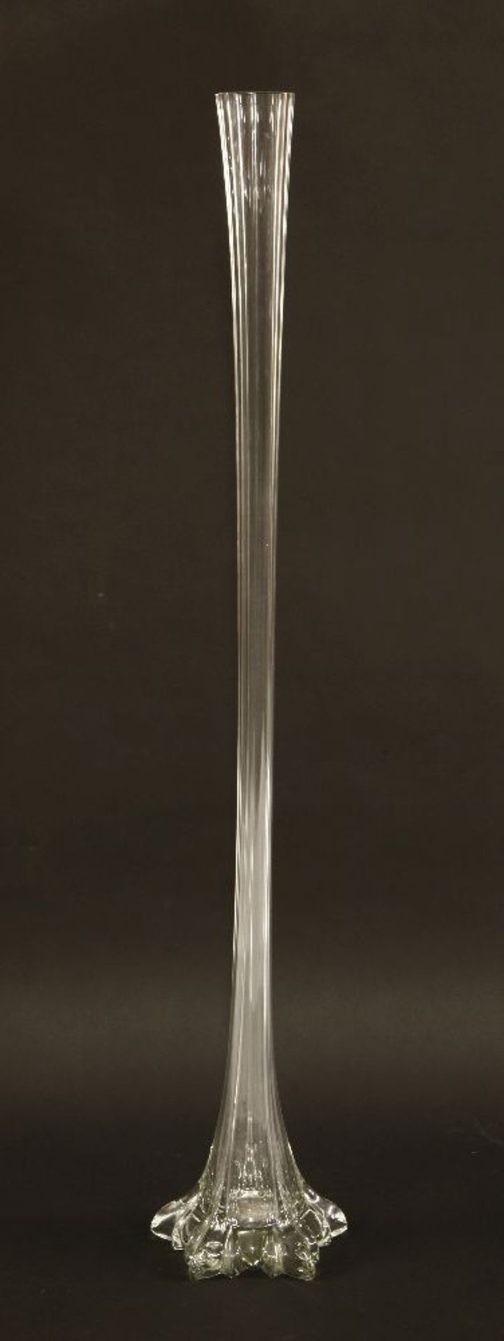 A large clear glass lily vase, of faced tapering form,109cm high