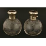 A pair of glass cologne bottles with silver and tortoiseshell covers,William Comyns, London 1915,