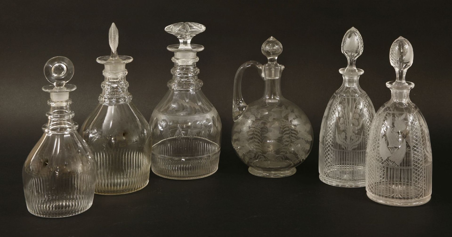 Five decanters,including:early 19th century, with a mushroom stopper, three facet cut rings and a