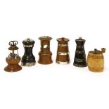 Six pepper pots, one ebony with silver bands, in the form of a milk pail,London, 1897, one of turned