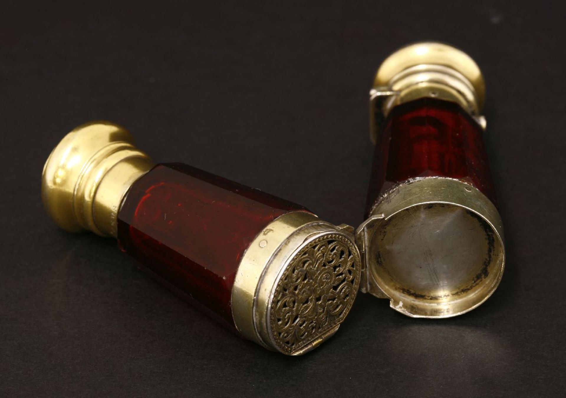 A Victorian ruby glass double-ended scent bottle and vinaigrette,the facet cut body with a central - Image 2 of 2