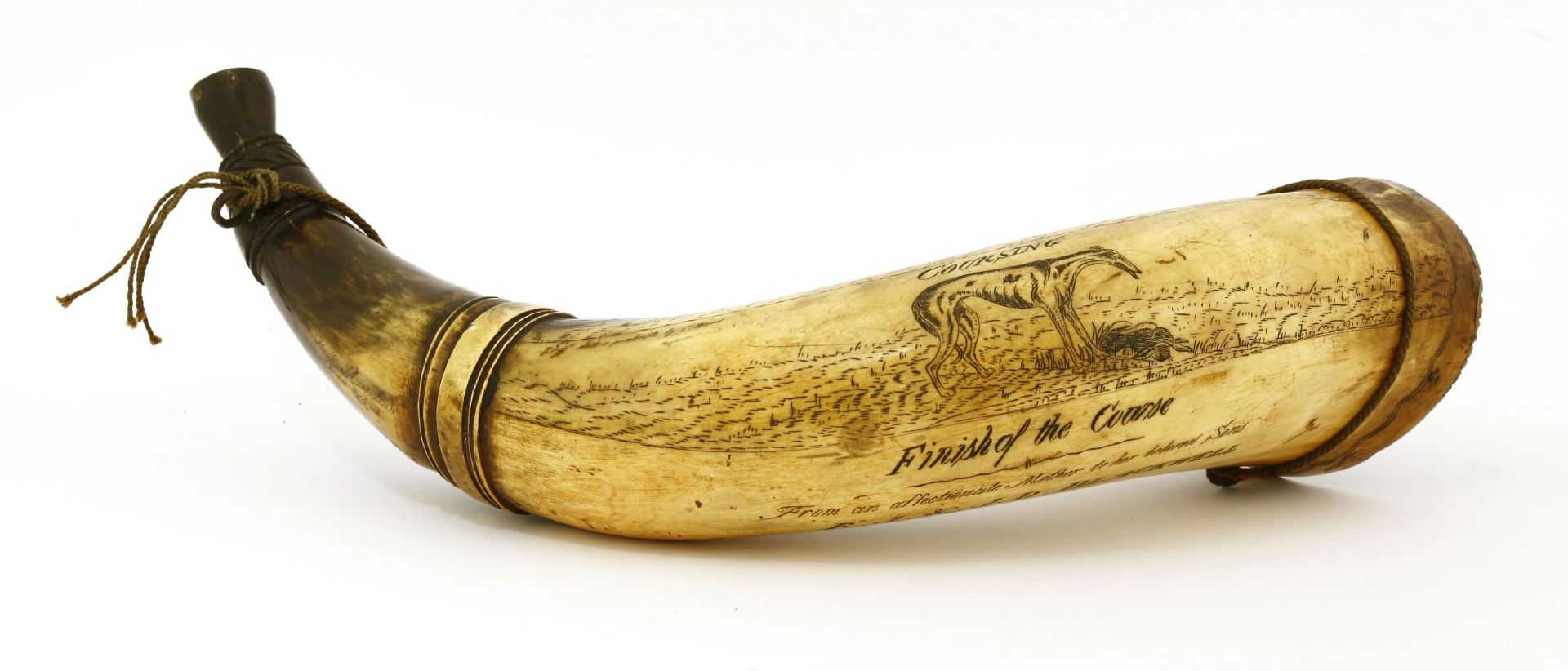 A scrimshaw hunting horn,mid-19th century, depicting hare coursing scenes, and inscribed 'From an