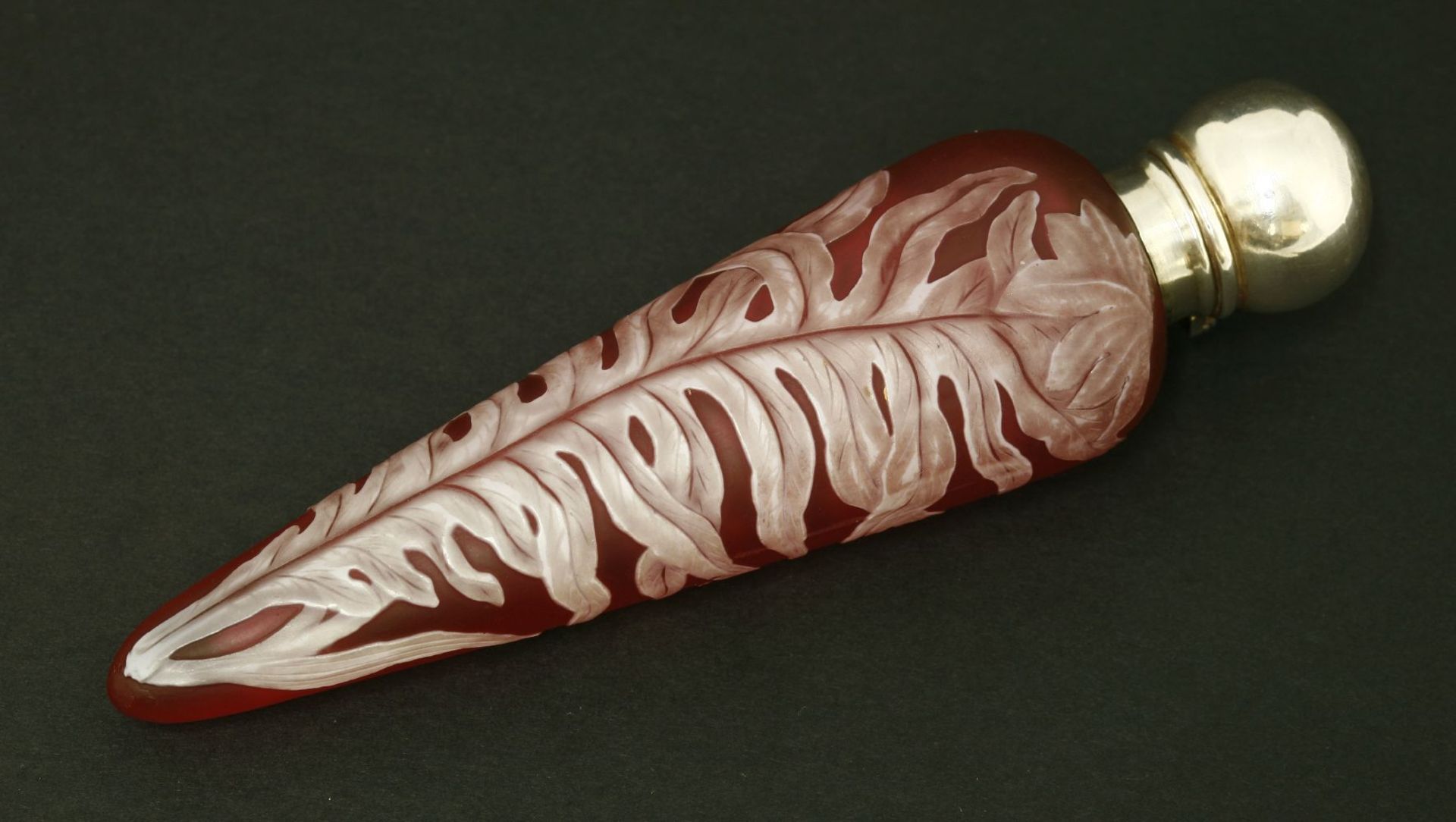 A cameo glass scent bottle,by Thomas Webb & Co, Stourbridge, the ruby glass body of elongated
