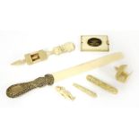 A collection of ivory items, 19th century, including:a page turner with a white metal handle, 33cm,a