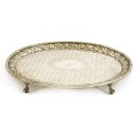 An American silver tray of oval form, the acanthus cast rim surrounding a repeating engraved