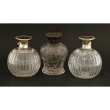 A pair of glass cologne bottles with silver and tortoiseshell hinged covers,Birmingham hallmarks