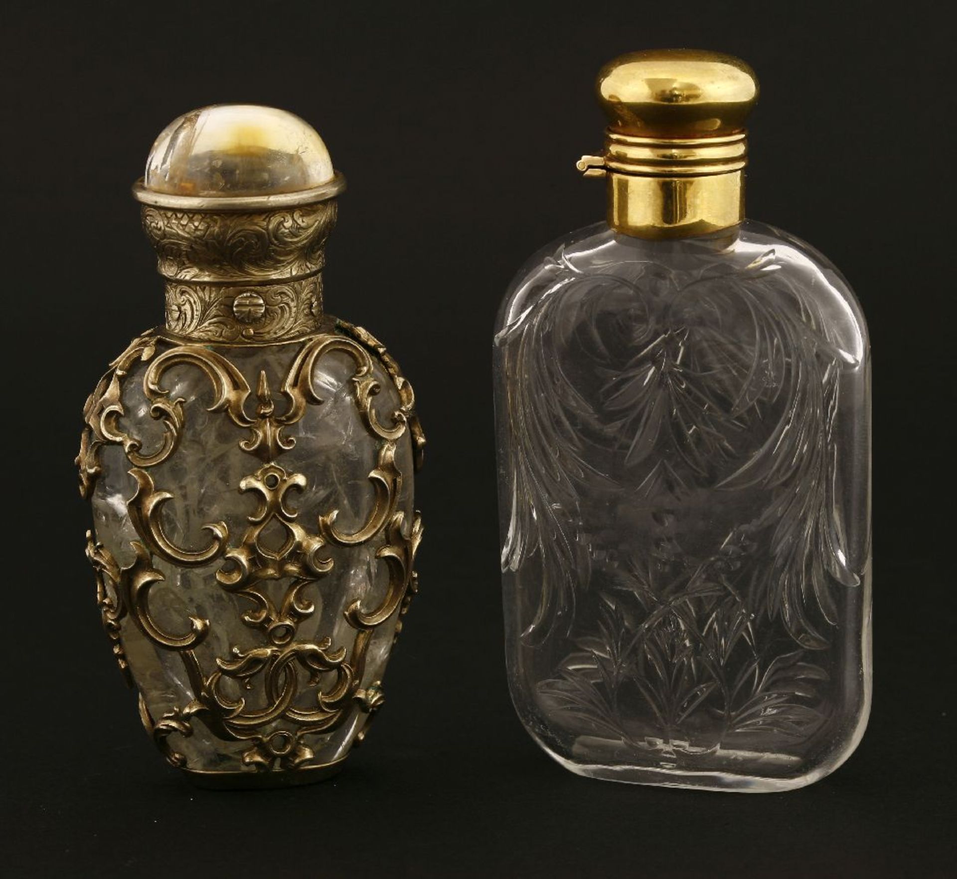 A Victorian cut-glass scent bottle,with rock crystal style decoration below a gilt metal hinged