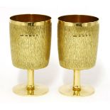 A pair of 18ct gold goblets,Gerald Benney, London, 1968,each with a bark finish to the bowls, a