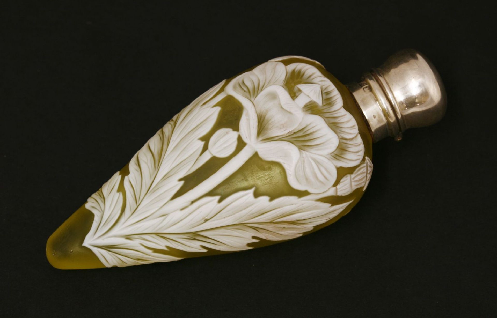 A cameo glass scent bottle,by Thomas Webb & Co, Stourbridge, the yellow glass overlaid in white with