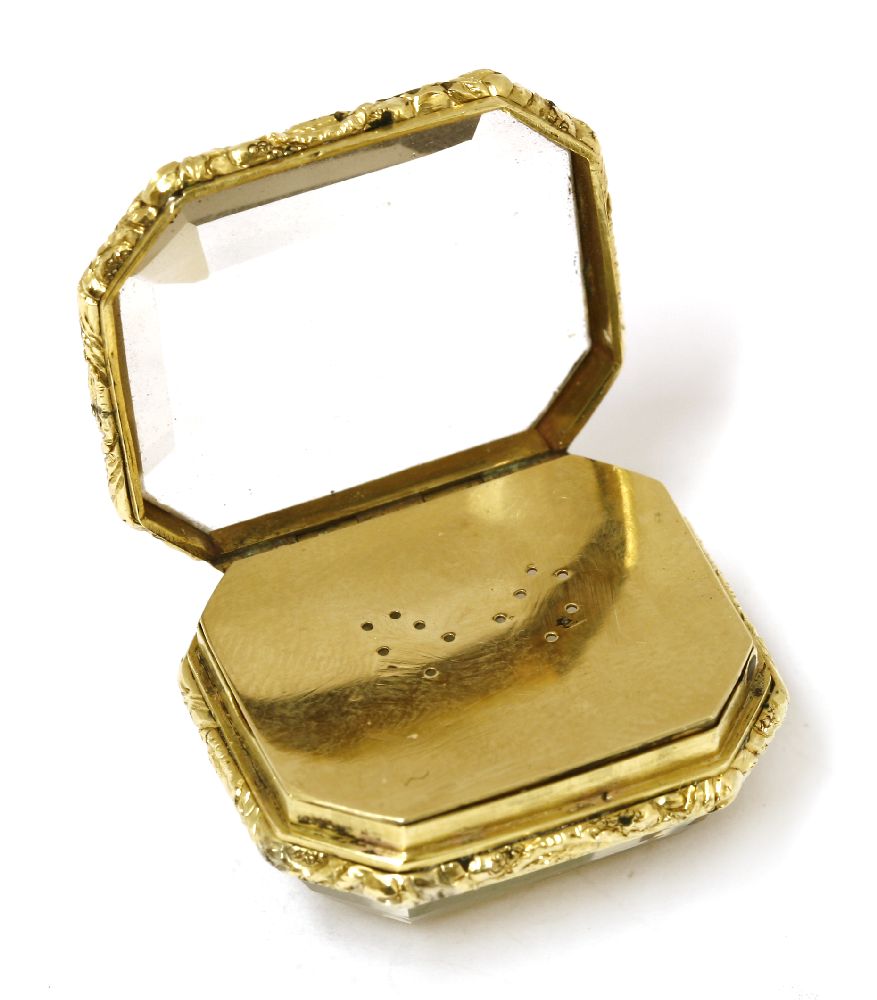 A gold-cased citrine vinaigrette,c.1820, the step-cut citrine within a chased floral border, with - Image 2 of 2