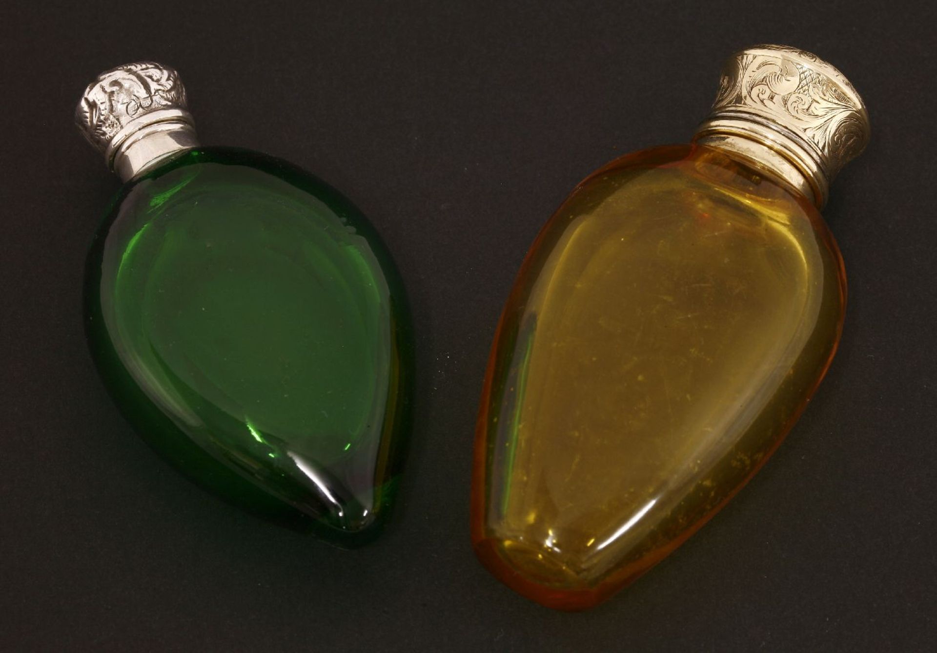 Two Victorian coloured glass scent bottles,one with a yellow teardrop-shaped body below a twist