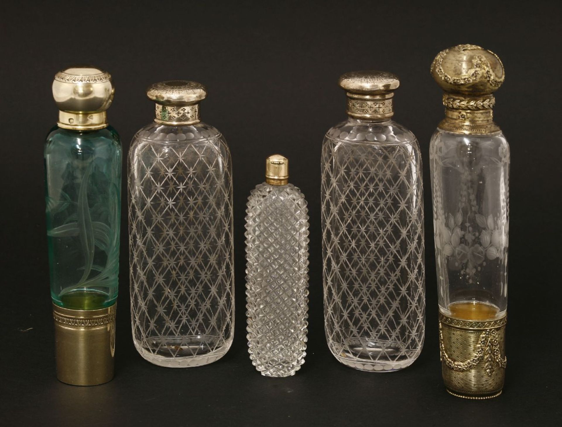Two French glass scent bottles,one with etched decoration and cast plated mounts,15.5cm,the other