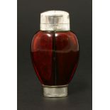 An unusual Victorian cranberry glass double scent bottle and vinaigrette,by Sampson Mordan & Co.,the