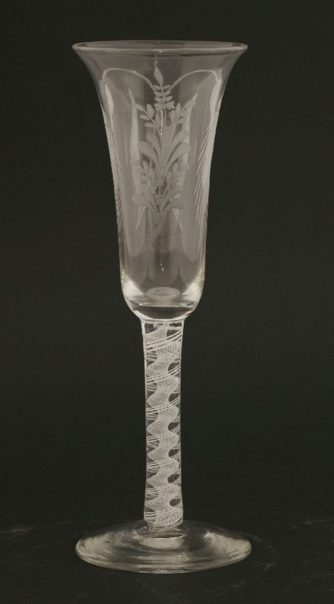 A George III ale glass,c.1770, the bell-shaped bowl engraved with barley ears on an opaque twist