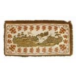 A tapestry wall hanging,mid-19th century, the central panel depicting a spaniel flushing a