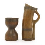 A large treen measure or flagon,with old iron mounts, old repairs,44cm high, anda turned wood