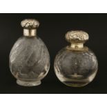 Two glass cologne bottles,with 'rock crystal' style cut decoration,one London 1892,the other with