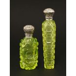 Two Victorian silver scent bottles,each with cut decoration below embossed silver hinged covers,