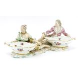 A near pair of Meissen porcelain figural salts,c.1880, modelled as a lady and a gentleman, each