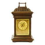 A German oak-cased mantel clock,late 19th century, with symphonion disc musical movement playing 4½