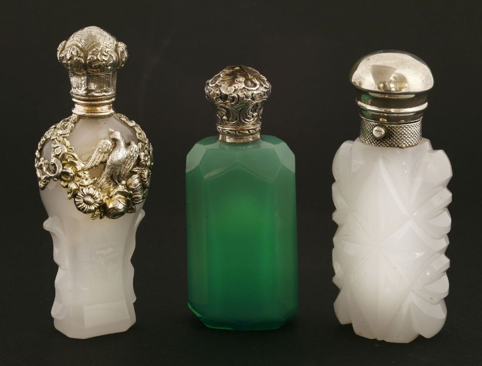 Three coloured glass scent bottles,19th century, one moulded opaline glass with an ornate white