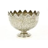 An Indian silver pedestal bowl,c.1890, attributed to Grish Chunder Dutt, with lobed rim and