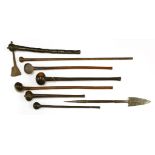 A collection of six knobkerries,longest 88cm,a short spear,69cm long, andan axe,56cm long (8)